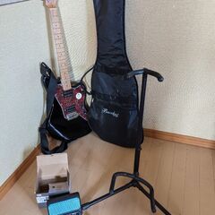 ほぼ新品、エレキギターと付属品の画像