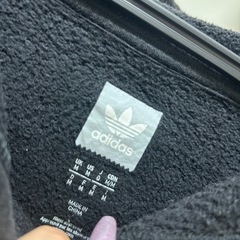 アディダスオリジナルス黒ボタニカルトレフォイルパーカーXLの画像