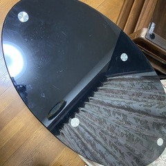 黒いガラステーブル　楕円形の画像