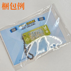 新品未使用 ハンドメイド オリジナルレジンキーホルダー switch・ゲーム機型 黄色＆白シャカシャカビーズ入り 黄色コントローラーデザインの画像