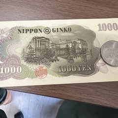 旧1000円札と内閣100年記念500硬貨の画像