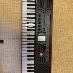 CASIO ミニキーボード　アダプター付きの画像