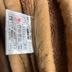茶色い毛布　縁に 毛玉ありの画像