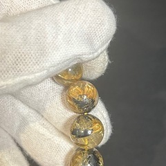 太陽放射ルチルクォーツ ブレスレット 約12mm玉 内径16cmの画像