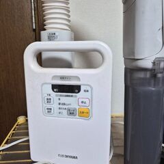 布団乾燥機。靴。の画像