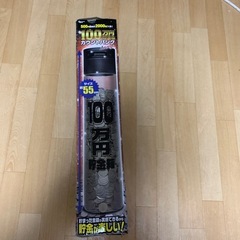 新品未使用100万円貯金箱の画像