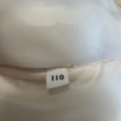 110 子ども　白　ダウンジャケットの画像