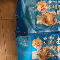 お茶パックとカルピス2本の画像