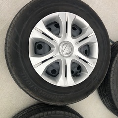 【商談中】14インチ　スチールホイール　キャップ付きe12ノート　日産　　　　185/70r14の画像