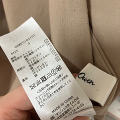 Mila Owenミラオーウェン ベージュ トレンチコート チェック裏地付きの画像