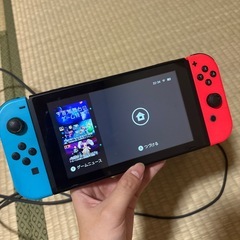 Switch 本体とドッグ、スプラ3カセット、コントローラーの画像
