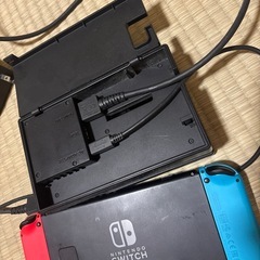 Switch 本体とドッグ、スプラ3カセット、コントローラーの画像
