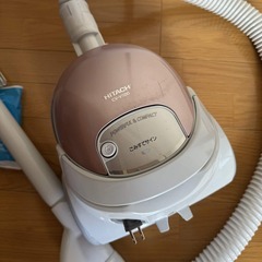 日立掃除機と未使用掃除機用紙パック3枚の画像