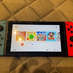 Nintendo Switch 本体 + マリオカート8 + ドラえもんケースの画像