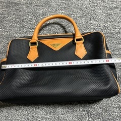 イヴサンローラン ミニボストン カサンドラロゴ ゴールド金具 黒と茶色の画像