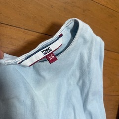 TOMMYぺプラムトップスの画像