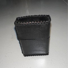 新品の金色ドラゴン模様ライター カバーと中古の本体のセットの画像