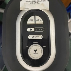 フィットネスバイクと空気清浄機の画像