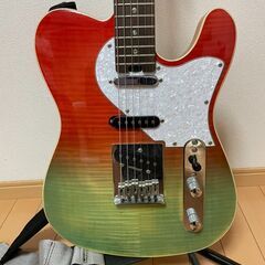 赤と緑のエレキギター＋ケース＋スタンドの画像