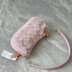 [コーチ] ライトピンク タンニン swinger シリーズ ヴィンテージ刺繍 マージャンバッグ 脇下バッグ 斜め掛けショルダーバッグの画像