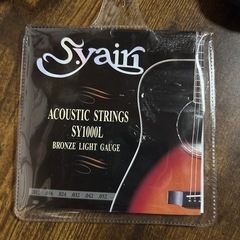 アコギギター・ギタースタンド・弦の予備の画像