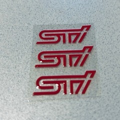 レガシィ 後期型 BRM 純正リアバンパー用マフラーカバー右とSTIステッカーの画像