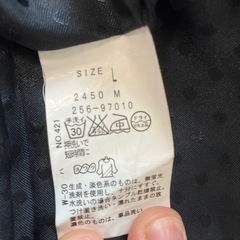 グレー トレンチコート Lサイズ 赤いボタンの画像