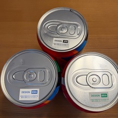 コカコーラの空き缶3点とタオル新品1まい1枚の画像