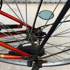 オレンジ色の自転車の画像