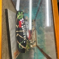 ケース入りの羽子板飾りの画像