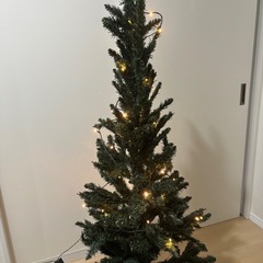 クリスマスツリー　150
cm  足元隠し&電飾付の画像