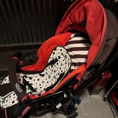 ベビーカーとアンパンマンよくばりビジーカーの画像