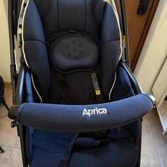 アプリカ　両対面ベビーカー　レインカバーつきの画像