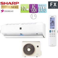 冷暖房機能を備えたSHARP製のエアコン、モデルAC-28NFX、2021年製。 の画像