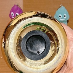 金のうんちくん貯金箱とストラップセットの画像