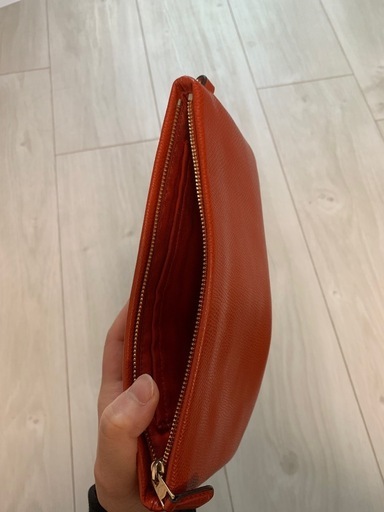 ほぼ新品】コーチのリストレット/ポーチ（朱色/赤色/オレンジ/レッド