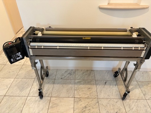 クロス糊付け機