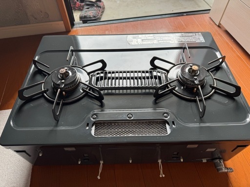 決定致しました！バーナーのグリル付き黒色ガスコンロ