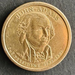 アメリカの第2代大統領ジョン・アダムズの肖像が描かれた1ドル硬貨の画像