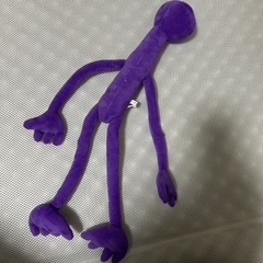 細長い生き物のぬいぐるみの画像