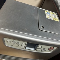 石油ストーブとタンクと吸い上げるやつの画像