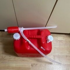 石油ストーブとタンクと吸い上げるやつの画像