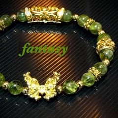 ペリドット 天然石 メタルパーツ 蝶々ブレスレットの画像