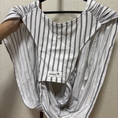 抱っこ紐と授乳ケープの画像