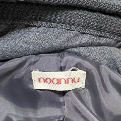 グレーのアウターの画像