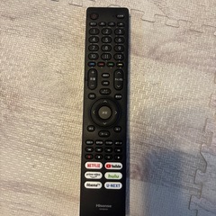 58型テレビとテレビ台の画像