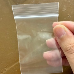 切手　ボタン　小物のチャック袋の画像