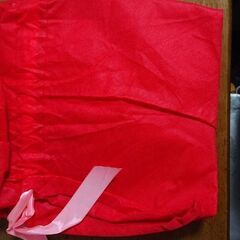 サンタコスとプレゼント袋 大3枚の画像