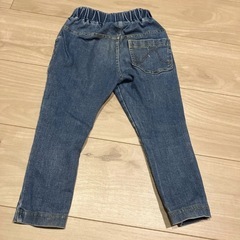 イエローフェイスのデニムパンツの画像