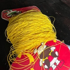 黄色のナイロンてぐすの画像